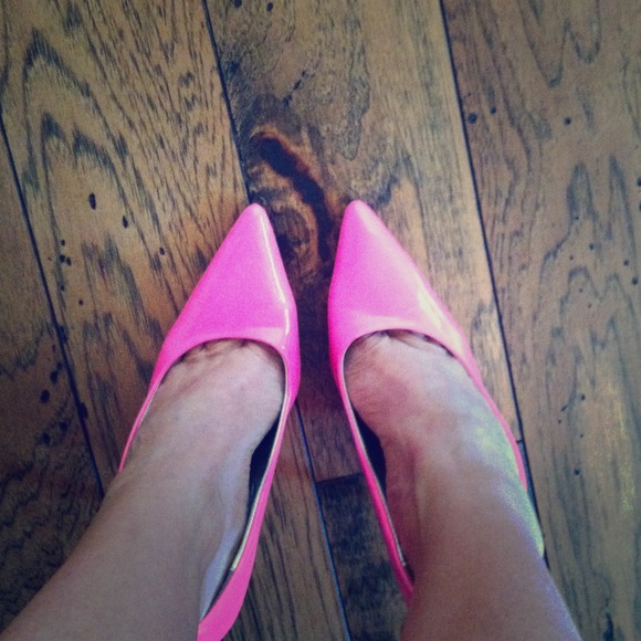 Hot pink patent pumps