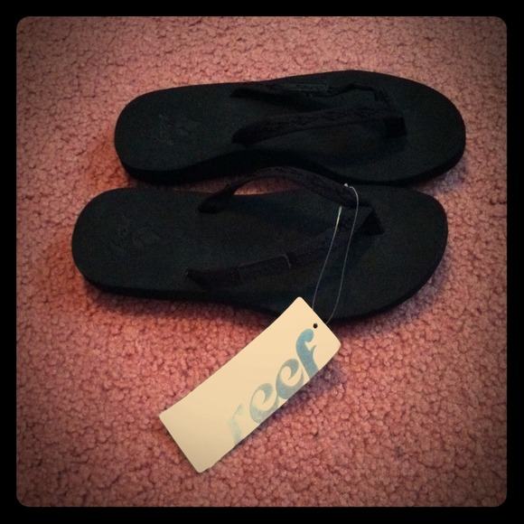 Reef Black flip flops. Women's size 4