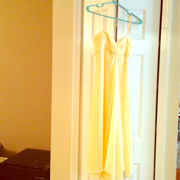 Yellow dress with sheer chiffon layers.