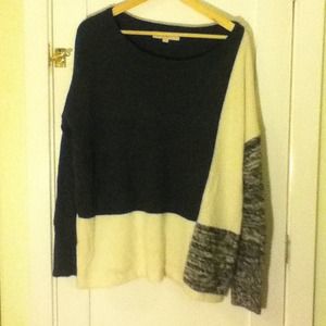 Oversized sweater with black and white patterning.
