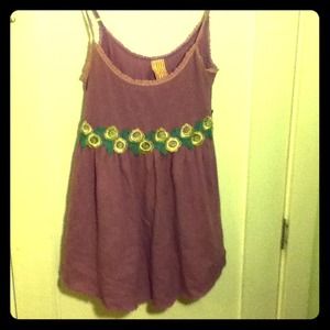 Purple babydoll cami top with floral detailing.