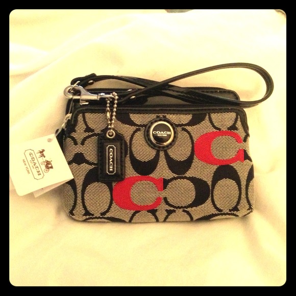 Authentic Coach signature double zip wrislet.