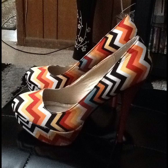 Red,black,orange,yellow and blue heels.