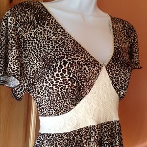 SOLD Animal print baby doll top with tie back.