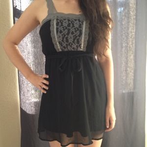 Adorable little black dress with grey lace details