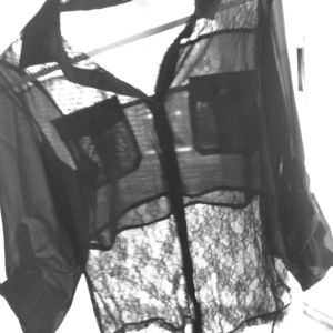 Sheer and lace button up shirt.