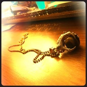 Gold tone tigers eye clawed necklace