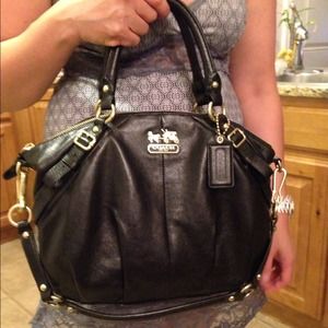 authentic black leather coach with gold hardware!