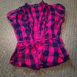 Ruffle button up shirt.