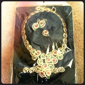 Three piece. Necklace, earrings, and bracelet.