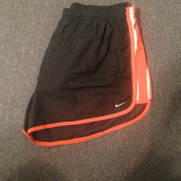 Grey black and orange Nike running shorts