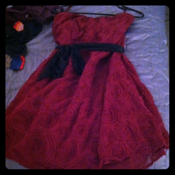 Romy wine colored dress with swirl designs.