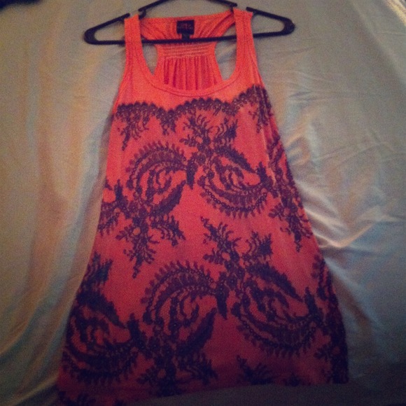 A coral pink bebe shirt/summer dress