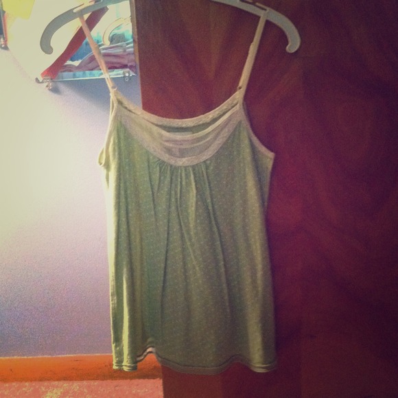 Green tank top with white polka dots and lace