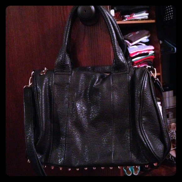 Studded bottom black handbag