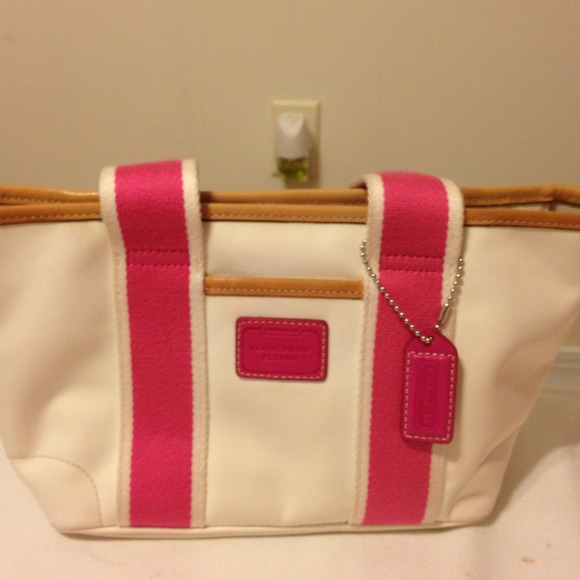 Small hot pink and white coach bag.