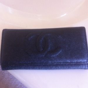 Black CC wallet. Used it only once/great condition
