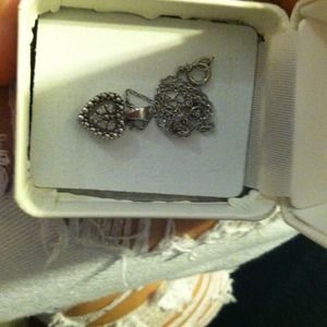 Sterling silver heart pendant with diamond accents