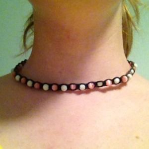 Black, pink, and white choker