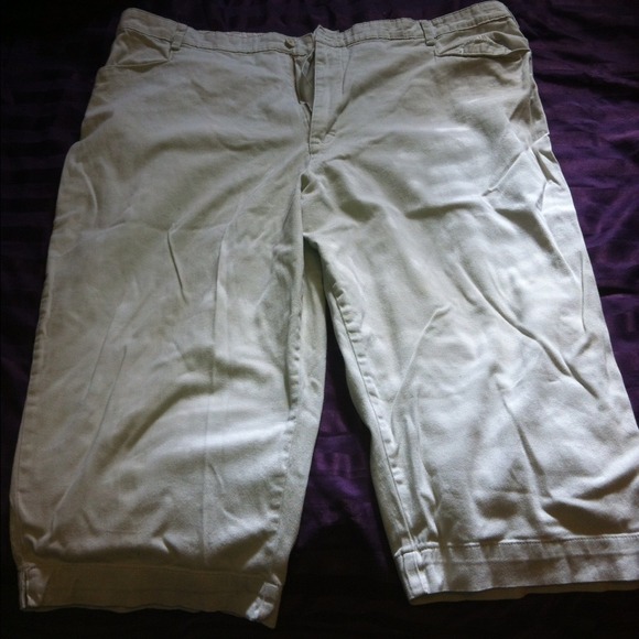Two pairs of Capri pant on brown on beige or tan.