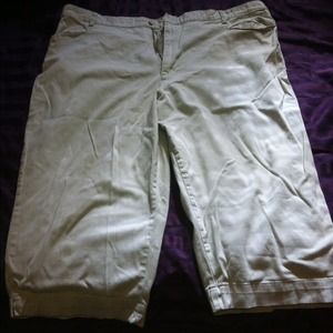 Two pairs of Capri pant on brown on beige or tan.