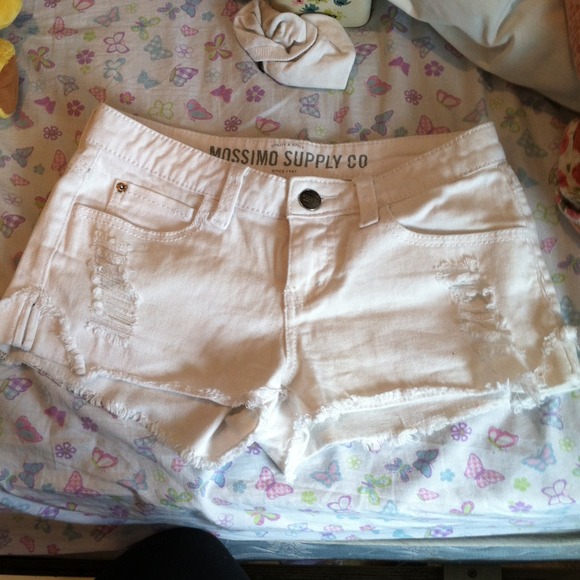 White ripped shorts