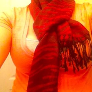 Red/blackish zebra print scarf.