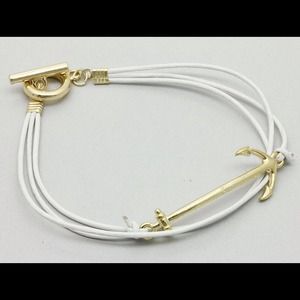 White & gold anchor cord bracelet.