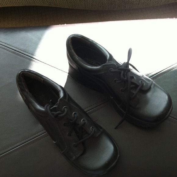 Black tie up shoes.