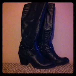 Black knee high boots with ankle bling.