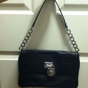 Black MK by Michael Kors envelope shoulder purse.