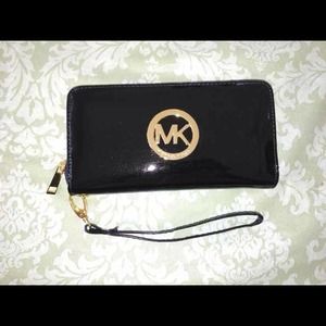 Michael Kors Wristlet . Brand new. Classic