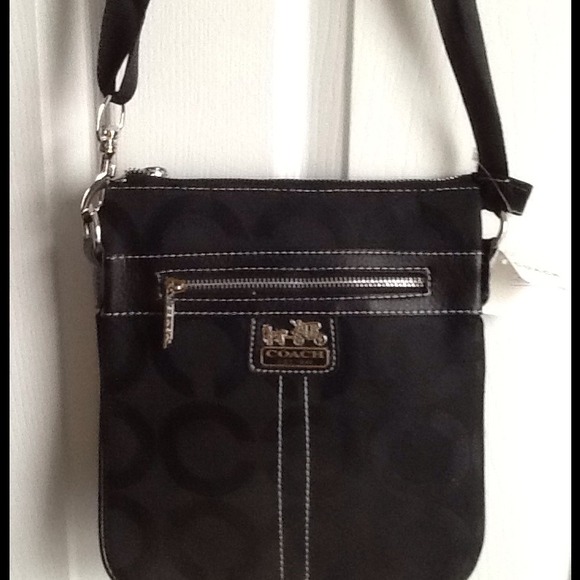 Black cross body, wallet, necklace, and sunglasses