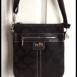 Black cross body, wallet, necklace, and sunglasses