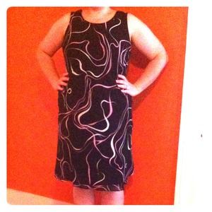 Black dress with pink and white swirls.