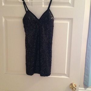 Short black sequin dress.