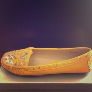 Yellow leather moccasins.