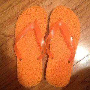 Orange spongelike flip flops