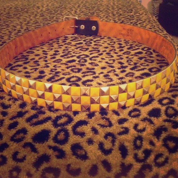Silver and yellow studded belt.