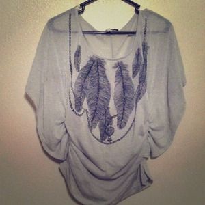 Cute gray sparkly shirt with black feather design