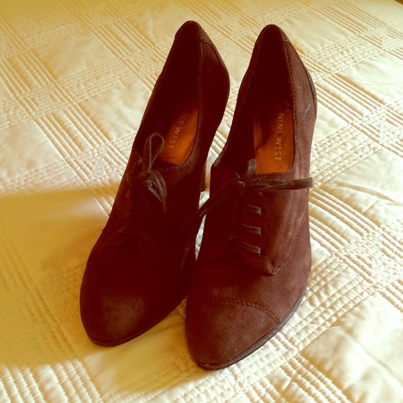 Brown Swede lace up boot heals.