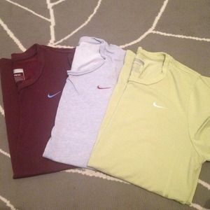 Three Nike workout tops