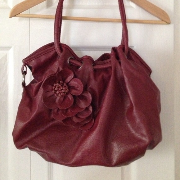 Large burgundy purse with rosé