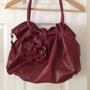 Large burgundy purse with rosé