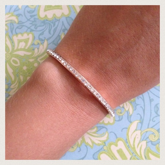 Rose gold tone bangle with rhinestones