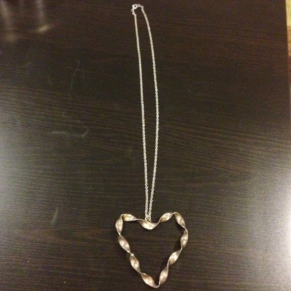 Long silver colored heart necklace