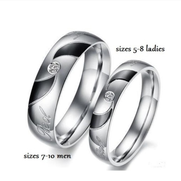 Brand new in packages!! Titanium love rings.