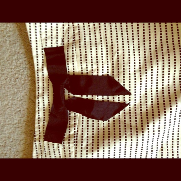 Cream a-line skirt with black bow