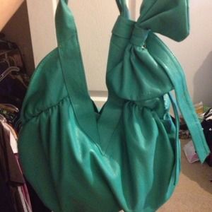 Mint/ turquoise colored purse with bow