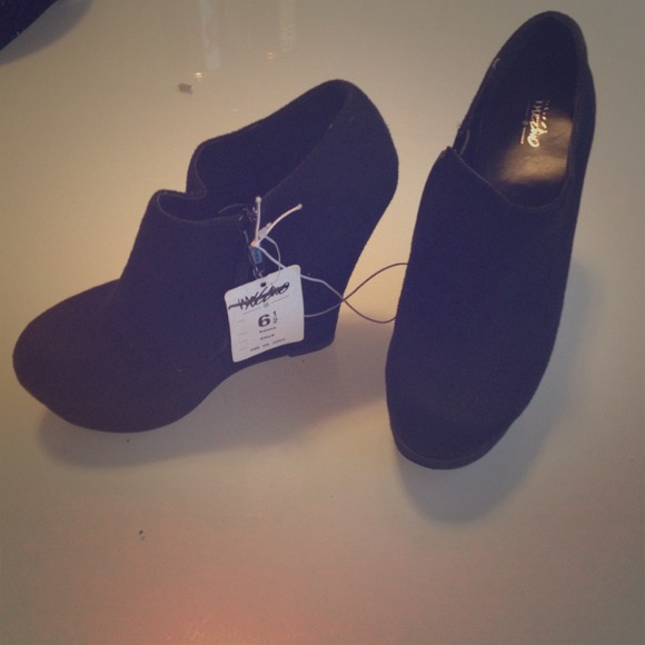 Brand new Black wedge booties.